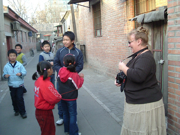 U.S. agricultural guests stop at a hutong in Beijing